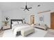 Bright bedroom with a ceiling fan, neutral decor, and lots of natural light, creating a peaceful retreat at 1498 Camp Point Ne Ct, Roswell, GA 30075
