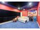 Finished basement media room with a large screen, projector, wet bar, and comfortable seating at 2080 Abbey Rd, Roswell, GA 30076
