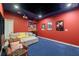Finished basement media room with a large screen, projector, wet bar, and comfortable seating at 2080 Abbey Rd, Roswell, GA 30076