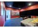 Finished basement media room with a large screen, projector, and comfortable seating at 2080 Abbey Rd, Roswell, GA 30076