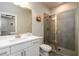Bathroom featuring modern vanity with sink, glass enclosed shower, and tile flooring at 2080 Abbey Rd, Roswell, GA 30076