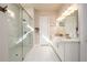 Beautiful bathroom with a double sink vanity and glass enclosed shower at 2080 Abbey Rd, Roswell, GA 30076