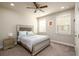Cozy bedroom with a comfortable bed, side tables, and natural light from the windows at 2080 Abbey Rd, Roswell, GA 30076