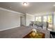 Open-concept living space with hardwood railing and lots of natural light at 2080 Abbey Rd, Roswell, GA 30076