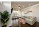 Inviting living room boasts hardwood floors, ample natural light, and a comfortable seating area at 2080 Abbey Rd, Roswell, GA 30076