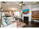 Open living area with hardwood floors, fireplace, and seamless transition to the dining area at 2080 Abbey Rd, Roswell, GA 30076