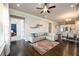 Spacious living area showcasing hardwood floors, an open layout, and access to other living spaces at 2080 Abbey Rd, Roswell, GA 30076