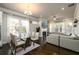 Bright and airy living space with hardwood floors, dining area, and seamless flow for entertaining at 2080 Abbey Rd, Roswell, GA 30076