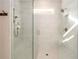 Glass enclosed marble tiled shower with rain shower and bench seating at 2080 Abbey Rd, Roswell, GA 30076