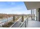 Balcony with a view of the pool area, greenery, and the city skyline in the distance at 2425 Peachtree Rd # 508, Atlanta, GA 30305
