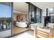 Balcony with cozy seating area and an open view of the living room and kitchen at 2425 Peachtree Rd # 508, Atlanta, GA 30305