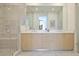Elegant bathroom with double vanity, large mirror, and walk-in shower at 2425 Peachtree Rd # 508, Atlanta, GA 30305