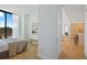 Bright bedroom featuring hardwood floors, light color walls, modern finishes and a large window providing ample natural light at 2425 Peachtree Rd # 508, Atlanta, GA 30305