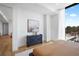 Bright bedroom featuring a view of the outdoor pool and seating at 2425 Peachtree Rd # 508, Atlanta, GA 30305