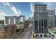 Street view featuring a modern high-rise apartment building with sleek architectural design and prominent signage at 2425 Peachtree Rd # 508, Atlanta, GA 30305