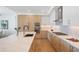 Modern kitchen with an island, stainless steel appliances, and sleek white and wood cabinets at 2425 Peachtree Rd # 508, Atlanta, GA 30305