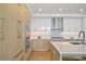 Well-equipped kitchen with stainless steel appliances, light cabinets, and a spacious island at 2425 Peachtree Rd # 508, Atlanta, GA 30305
