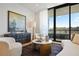 Stylish living room with unique decor, modern furniture, and large windows overlooking the exterior at 2425 Peachtree Rd # 508, Atlanta, GA 30305