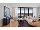 Stylish living room features modern furniture, hardwood floors, and bright, airy windows at 2425 Peachtree Rd # 508, Atlanta, GA 30305