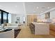 Open concept living space with an island kitchen and living area with hardwood floors at 2425 Peachtree Rd # 508, Atlanta, GA 30305
