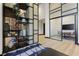 Modern lobby area with stylish shelving, artwork, and a glimpse into a conference room at 2425 Peachtree Rd # 508, Atlanta, GA 30305