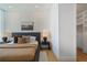Comfortable bedroom with hardwood floors and a glimpse into a large walk-in closet at 2425 Peachtree Rd # 508, Atlanta, GA 30305