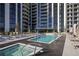 Luxury building featuring a stunning pool and hot tub with plenty of seating at 2425 Peachtree Rd # 508, Atlanta, GA 30305