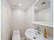 Modern bathroom with a toilet and sleek sink with a faucet with tiled wall at 4060 Haverhill Ne Dr # F, Atlanta, GA 30342