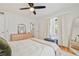 Bright bedroom features hardwood floors, lots of natural light from big windows, and a modern ceiling fan at 4060 Haverhill Ne Dr # F, Atlanta, GA 30342