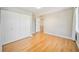 Spacious bedroom with hardwood floors, a large closet, and easy access to the hallway at 4060 Haverhill Ne Dr # F, Atlanta, GA 30342