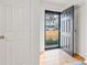 Inviting entryway with hardwood floors and a stylish black front door offering a view of the home's exterior at 4060 Haverhill Ne Dr # F, Atlanta, GA 30342