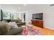 Inviting living room features an olive green sofa, hardwood floors, and recessed lighting at 4060 Haverhill Ne Dr # F, Atlanta, GA 30342
