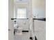 Classic bathroom with subway tile, black accents, and patterned tile floor at 509 Ponce De Leon Pl, Decatur, GA 30030