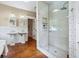 Bathroom features a glass-enclosed shower, double sinks and wainscoting at 509 Ponce De Leon Pl, Decatur, GA 30030