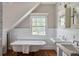 This bathroom features a clawfoot tub, double sinks and wainscoting at 509 Ponce De Leon Pl, Decatur, GA 30030