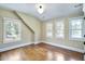 Bright and airy bedroom with hardwood floors and ample natural light from three windows at 509 Ponce De Leon Pl, Decatur, GA 30030