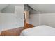 Bedroom featuring beadboard paneling, hardwood floors, and a closet at 509 Ponce De Leon Pl, Decatur, GA 30030