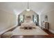 Bright bedroom featuring a high vaulted ceiling, hardwood floors, a large rug and stylish furniture at 509 Ponce De Leon Pl, Decatur, GA 30030