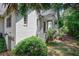 View of house exterior showing a brick home, steps, porch, and garage at 509 Ponce De Leon Pl, Decatur, GA 30030