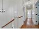 Upstairs hallway with hardwood floors, white wainscoting, and elegant lighting at 509 Ponce De Leon Pl, Decatur, GA 30030