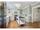 Spacious kitchen featuring stainless steel appliances, custom cabinets, subway tile backsplash, and a functional center island at 509 Ponce De Leon Pl, Decatur, GA 30030
