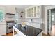 Open kitchen with ample counter space, subway tile backsplash, stainless steel appliances, and custom cabinetry at 509 Ponce De Leon Pl, Decatur, GA 30030
