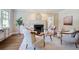 Well-lit living room with hardwood floors, a fireplace, and comfortable seating at 509 Ponce De Leon Pl, Decatur, GA 30030