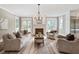 Spacious living room with a fireplace, neutral color scheme, hardwood floors, and ample natural light at 509 Ponce De Leon Pl, Decatur, GA 30030