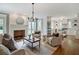 Bright living room connected to the kitchen, with a brick fireplace, neutral tones, and comfortable seating at 509 Ponce De Leon Pl, Decatur, GA 30030