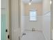 Clean room featuring wainscotting, a window with white trim, and tiled floors at 509 Ponce De Leon Pl, Decatur, GA 30030