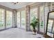 Bright sunroom with multiple windows, patterned curtains, and calming natural light at 509 Ponce De Leon Pl, Decatur, GA 30030