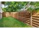 Enclosed backyard with a well-maintained lawn and wooden fence, offering privacy and a serene outdoor space at 520 Wabash Ne Ave, Atlanta, GA 30312