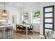 Dining area features a modern light fixture, a table with seating for six and a backyard view at 520 Wabash Ne Ave, Atlanta, GA 30312