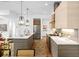 Modern kitchen featuring a large island, stainless steel appliances, white countertops, and light wood cabinetry at 520 Wabash Ne Ave, Atlanta, GA 30312